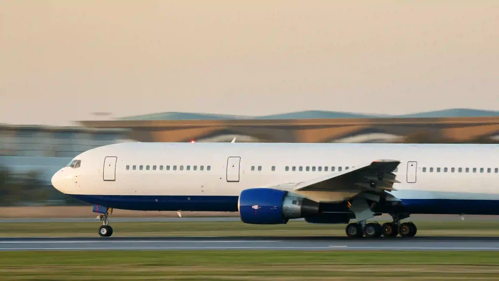 Commercial Airplane running on runway preparing for takeoff