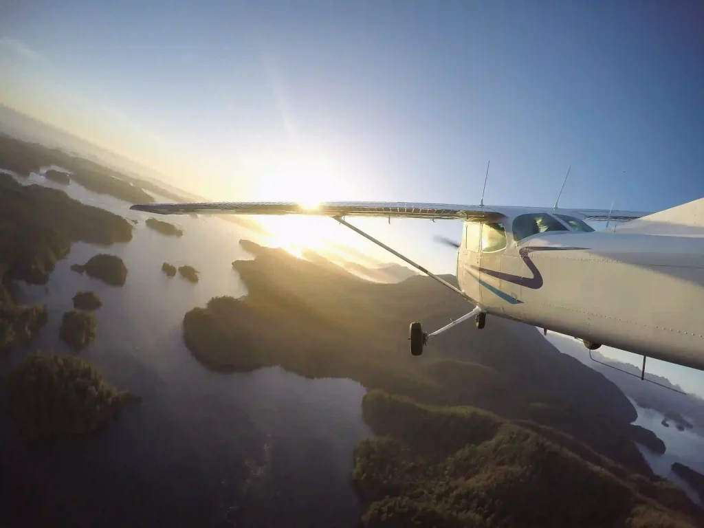 AAG aircraft flying above coastal area